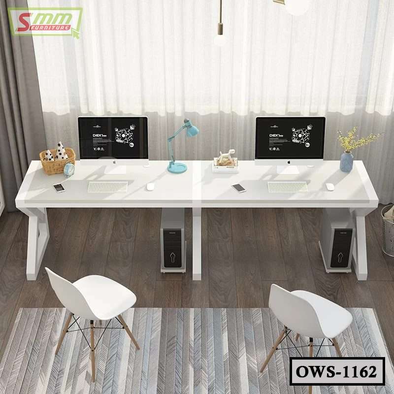 Modern white office workstation desk with dual computers, two chairs, and accessories