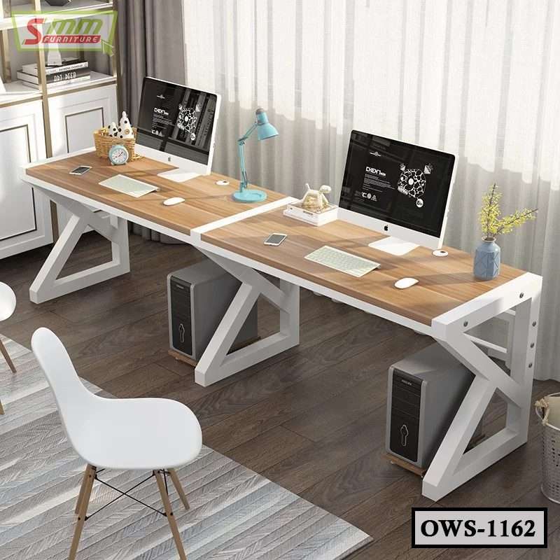 Modern double office workstation desk with wood top, white frame, and two desktop computers