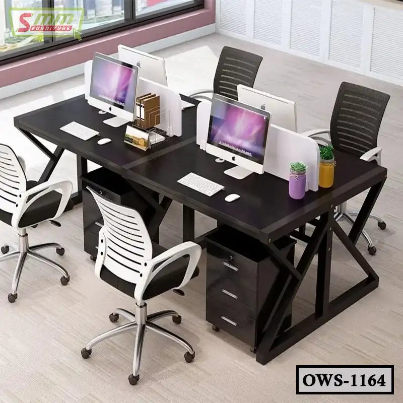 Modern office workstation with four chairs, desktop computers, and black desk setup