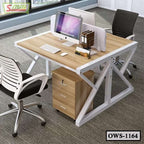 Modern office workstation desk with computers, divider, chairs, and storage drawers
