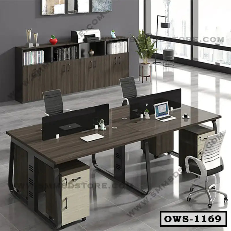 Modern office workstation desk with chairs, divider screens, and storage cabinets in a bright workspace.