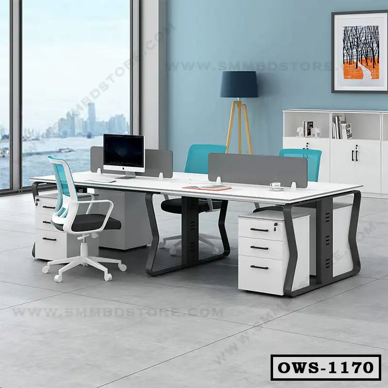 Modern office workstation desk with partitions, ergonomic chairs, and storage drawers in spacious workspace