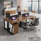 Modern office workstation with wood desk, black chairs, laptops, and city view