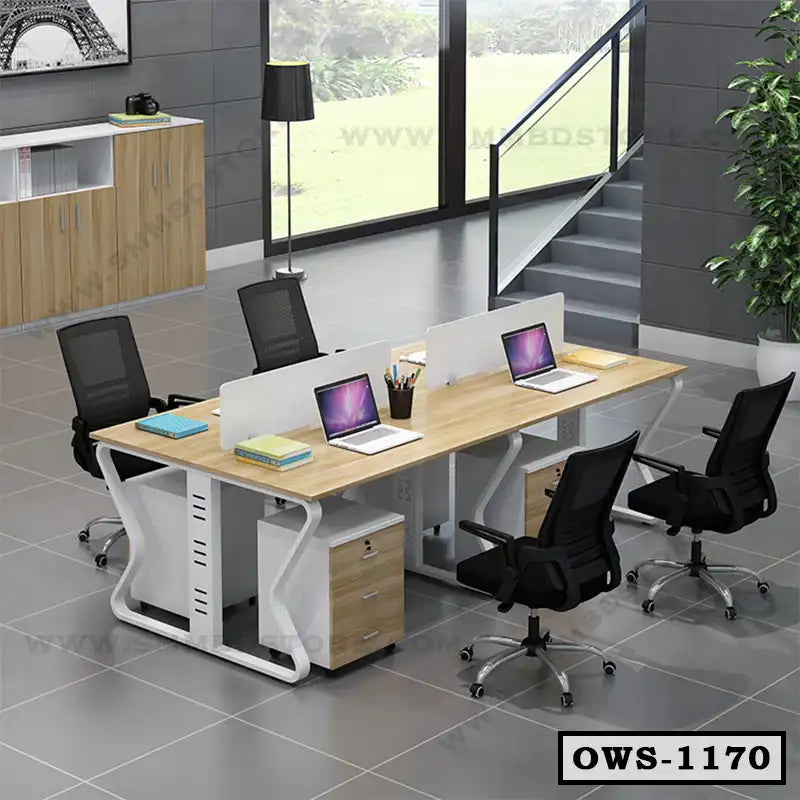 Modern office workstation desk with partitions and black swivel chairs in a bright workspace
