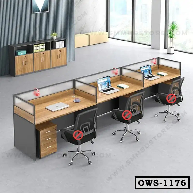 Modern office workstation with three desks, black chairs, wooden drawers, and laptops