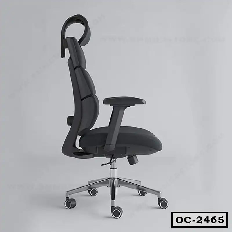 Ergonomic black office chair with adjustable armrests, headrest, and wheels, side view