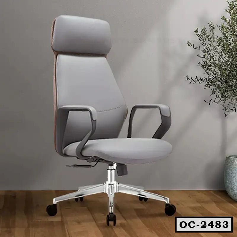 Modern ergonomic office chair with grey upholstery, armrests, and wheels on wooden floor