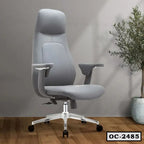 Modern ergonomic grey office chair with adjustable arms on wooden floor, indoor plant nearby