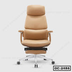 Ergonomic tan leather office chair with footrest, adjustable armrests, and metal base on casters