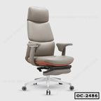 Ergonomic executive office chair with headrest, adjustable armrests, and footrest, gray upholstery