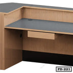 Modern wooden office desk with a built-in drawer and cable management hole