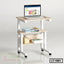 Portable laptop table with wheels, shelves, books, and a laptop on top, ideal for home office