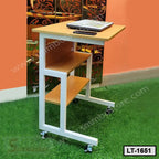 Portable laptop table with wheels, two shelves, and light wood finish, placed indoors
