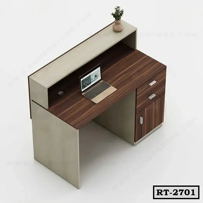 Modern office reception table with wood finish, drawers, laptop, and potted plant