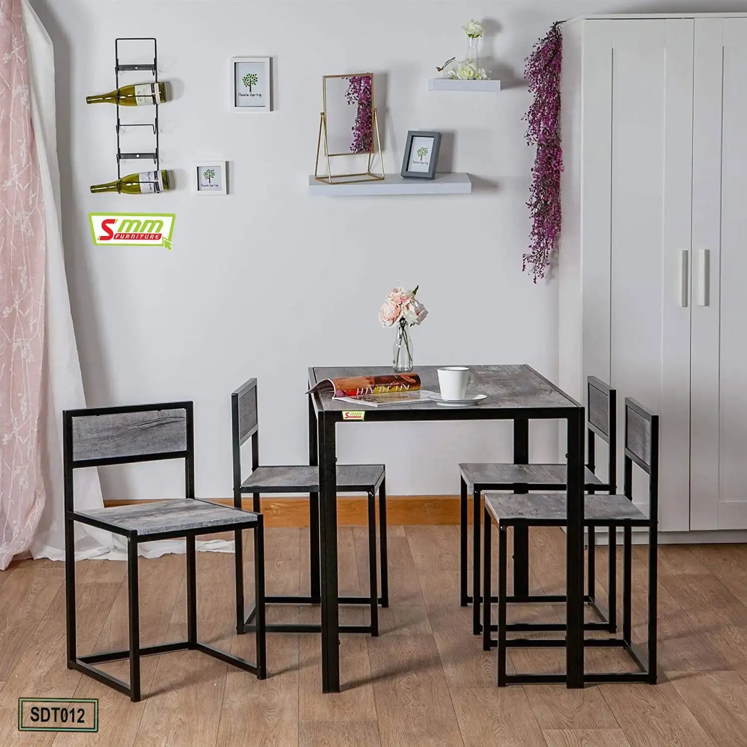 Modern dining table set with four chairs, black metal frame, wood finish, in a stylish room