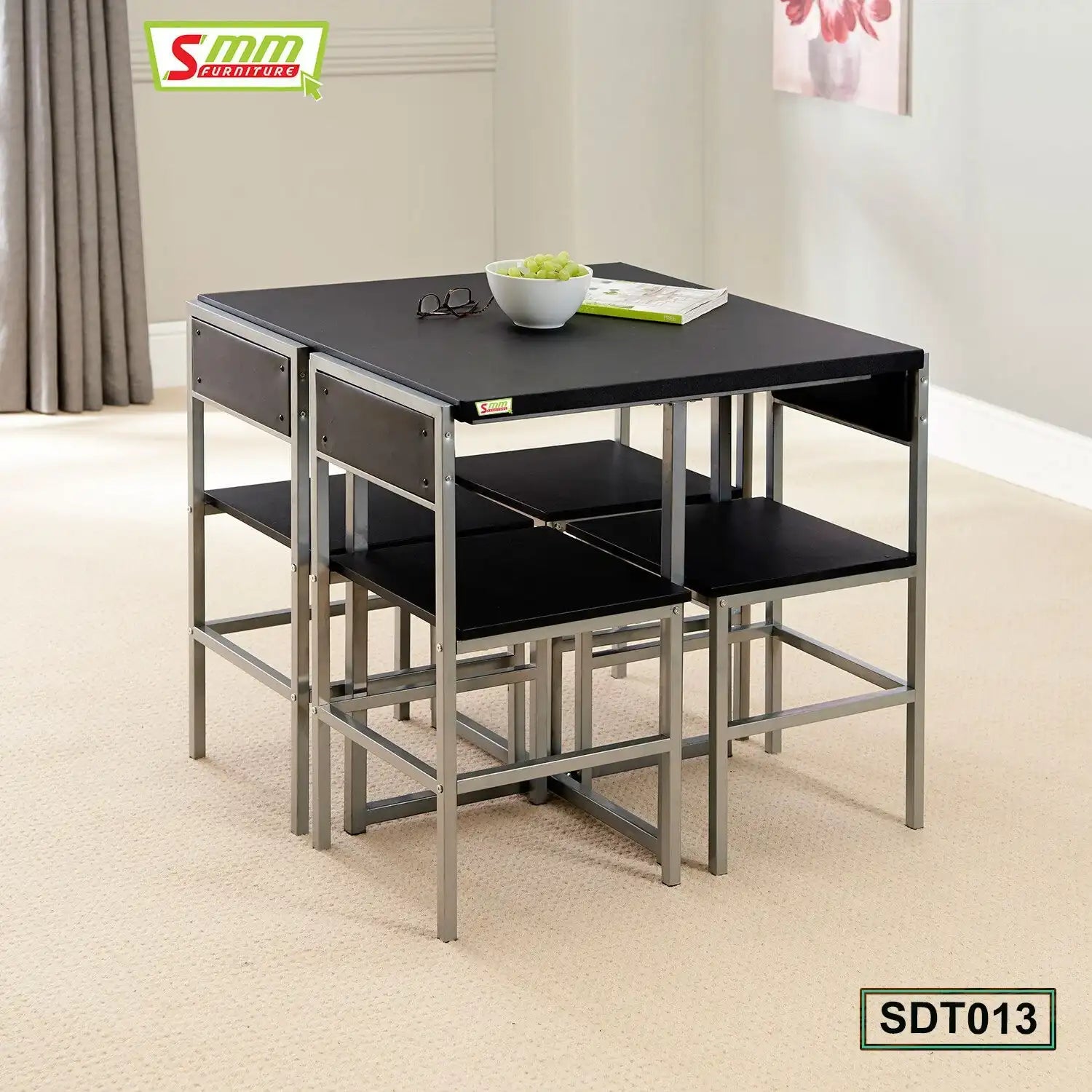 Modern black dining table set with four chairs, metal frame, in a bright living room