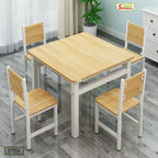 Modern light wood and white dining table set with four chairs in a bright room