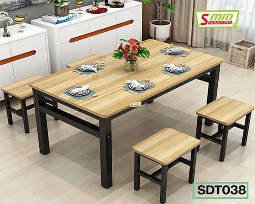 Modern dining table set with four wooden benches and black metal frame, table set for six.