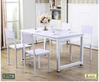 Modern white dining table set with four chairs, floral centerpiece, and tableware in a bright room