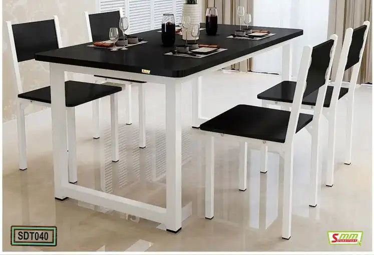 Modern black and white dining table set with four chairs in a bright dining room Main image
