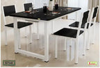 Modern black and white dining table set with four chairs in a bright dining room