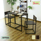 Modern dining table set with two chairs, black metal frame, and wood finish in bright room
