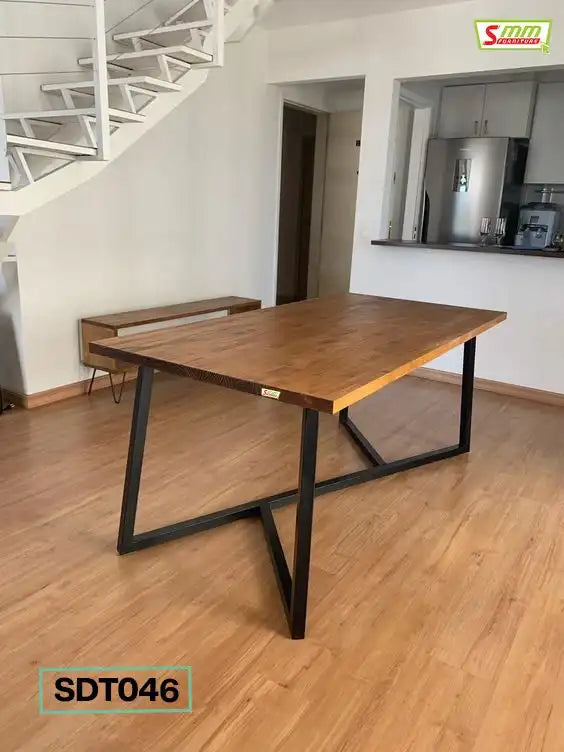 Modern wooden dining table with black metal legs in a bright home interior Main image