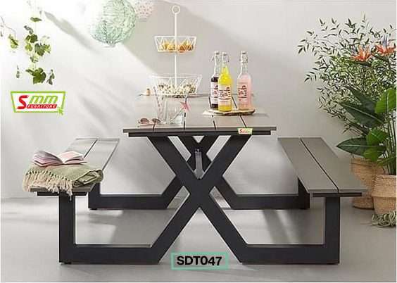 Modern black picnic table with benches set indoors, styled with drinks and plants, SDT047 model.