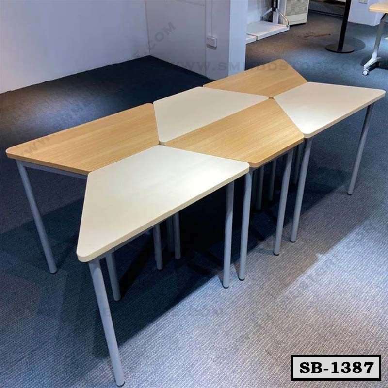 Modern modular school benches with triangular wood and white tabletops on metal legs.
