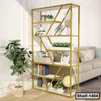 Modern gold metal bookshelf with geometric design, holding books, plants, and decor in a living room