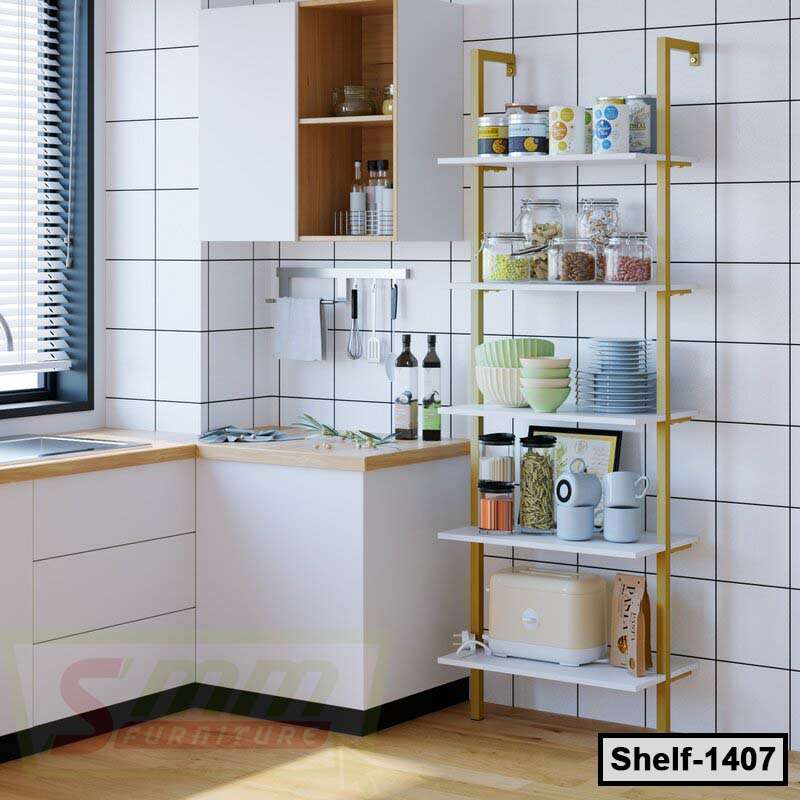 Modern kitchen shelving unit with white shelves and gold frame, kitchenware and groceries displayed.