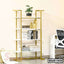 Modern gold and white bookshelf with decorative items for home or office interior