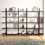 Modern black wooden bookshelf with books, plants, and decorative items in a living room.