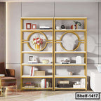 Modern gold metal bookshelf with circular design, holding books, decor, and vases in a living room