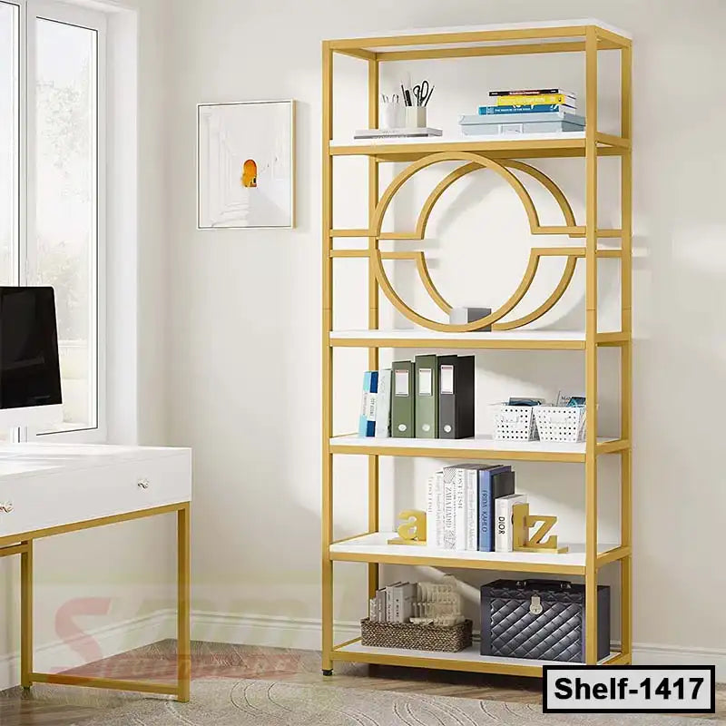 Modern gold and white office bookshelf with decorative geometric design, books, and desk nearby