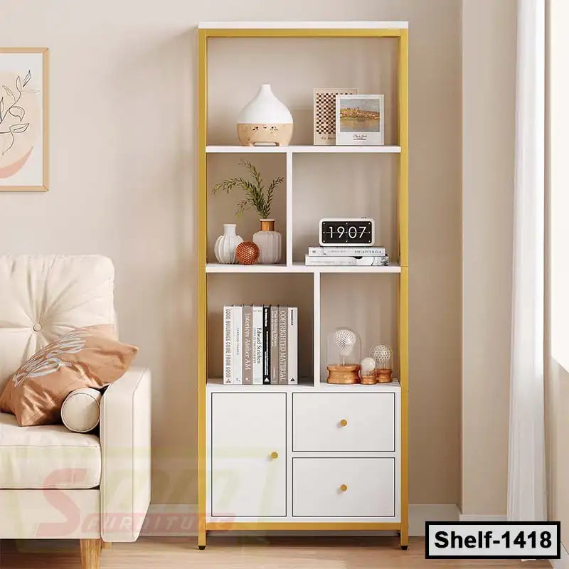 Modern white and gold bookshelf with drawers, decor items, and books in a cozy living room. Main image