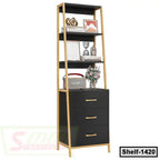 Modern black and gold standing shelf with three drawers and decorative items