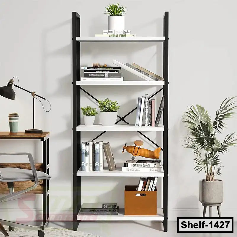 Modern white and black bookshelf with books, plants, and decor in a home office setting