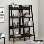 Modern black ladder bookshelf with plants, books, and decor in a contemporary living room