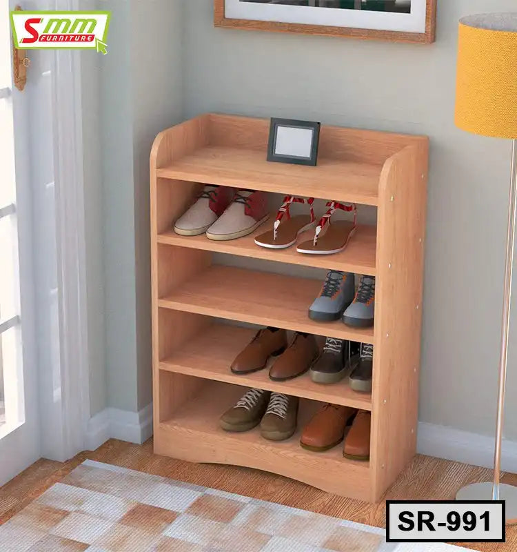 Wooden four-tier shoe rack with multiple pairs of shoes, placed in an entryway corner Main image