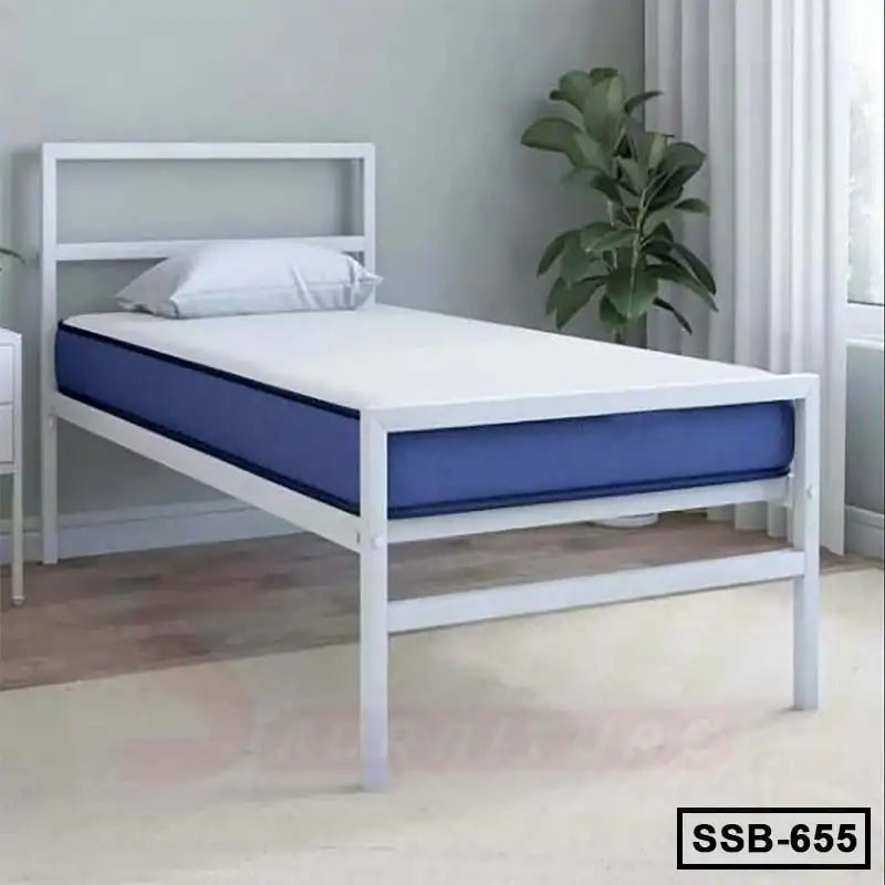 Modern single steel bed with headboard, blue mattress, in a bright bedroom with plant