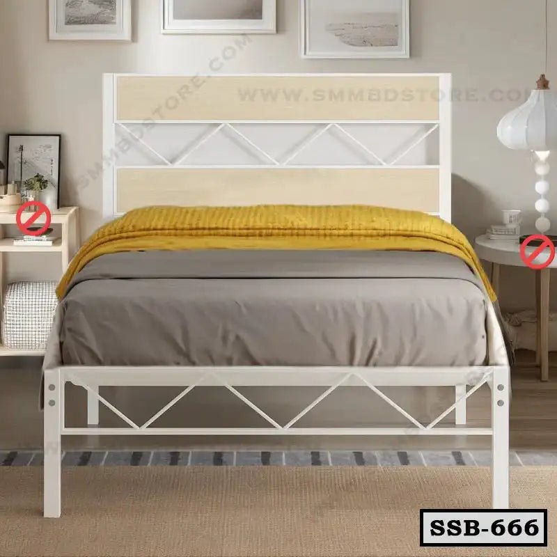 Single steel bed with white and beige frame, yellow blanket, modern bedroom decor