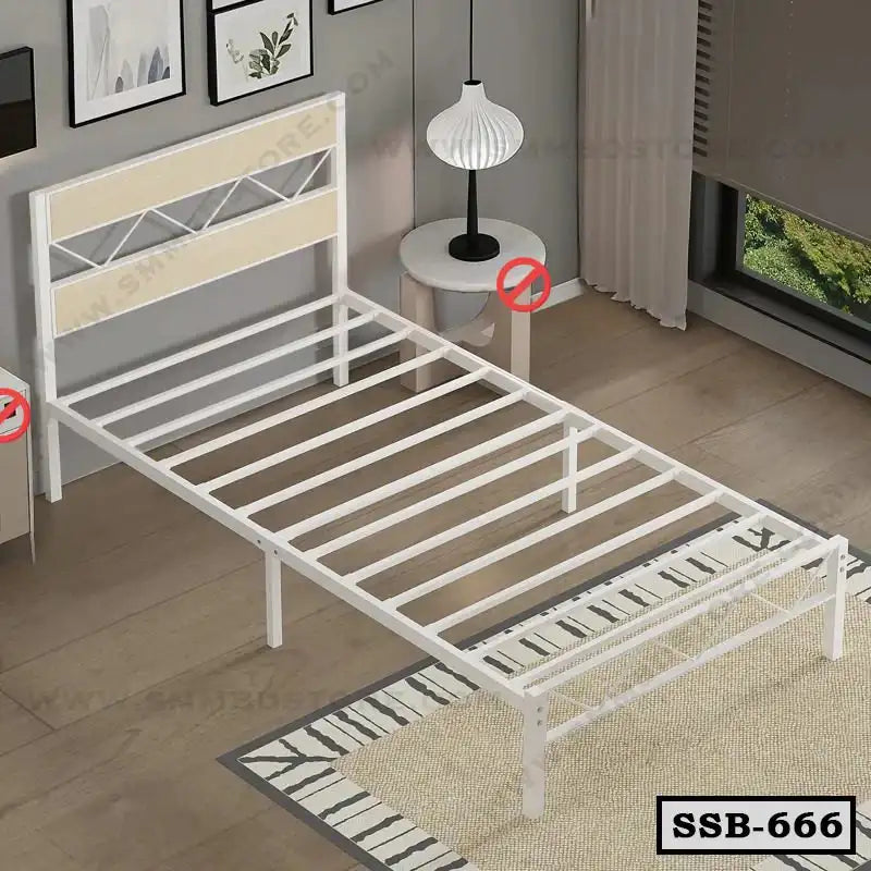 Modern single steel bed frame in white, placed in a bright bedroom with wooden floor.