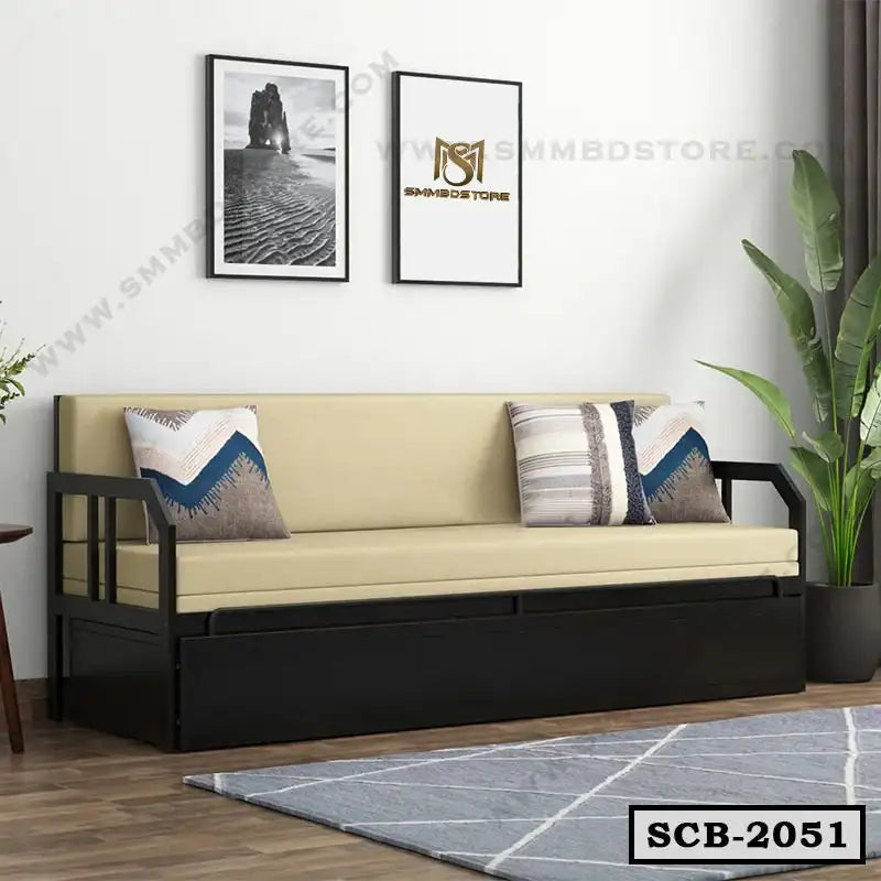 Modern sofa cum bed with beige cushions, dark frame, and throw pillows in a living room setting Main image