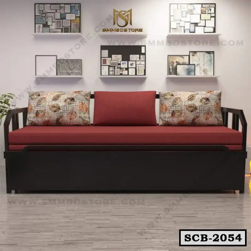 Modern sofa cum bed with maroon cushions and floral pillows in a stylish living room Main image