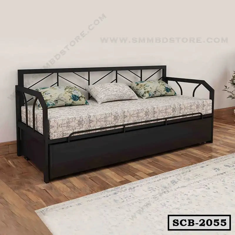 Modern black metal sofa cum bed with patterned cushions in a minimalist living room