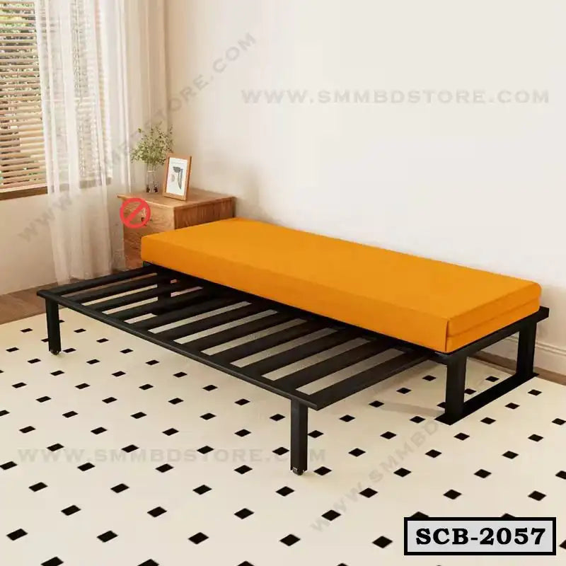 Modern black metal sofa cum bed with orange cushion in a bright living room Main image