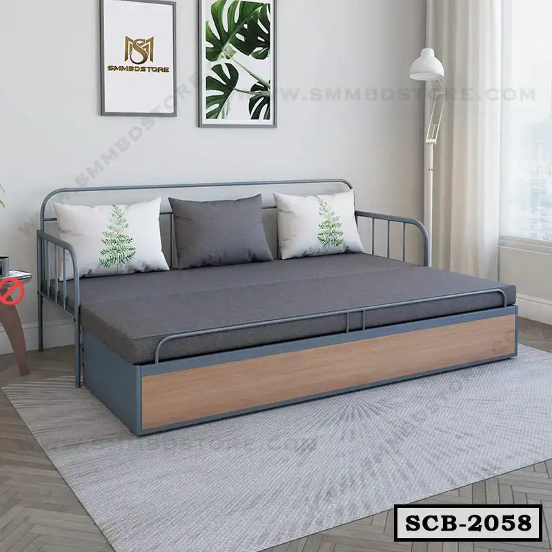 Modern metal sofa cum bed with gray mattress and decorative cushions in bright living room Main image