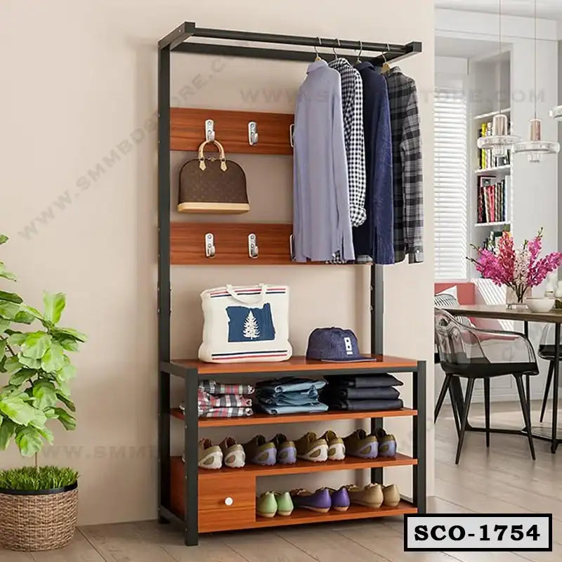 Standing wooden closet organizer with shelves, clothing rack, hooks, and shoe storage in a modern room