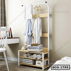 Standing closet organizer with hanging rod, shelves, and folded linens in a modern bedroom